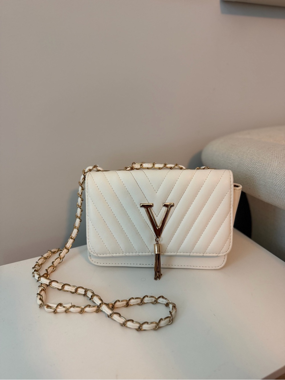 White Quilted Crossbody Bag with Gold V Tassel